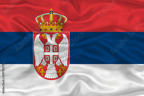 Foto Serbian flag textured with fabric background