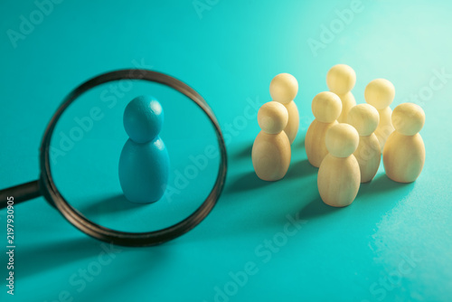 Magnifier and figures of people on Search for employees.