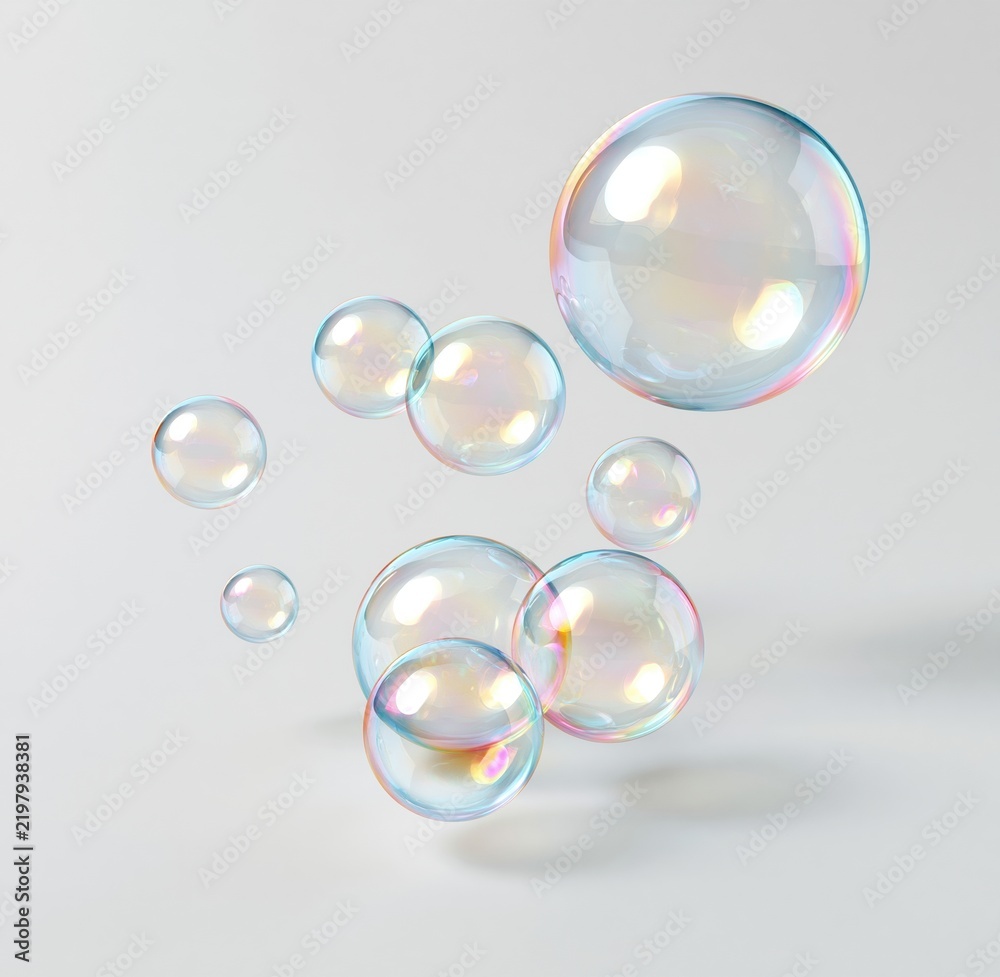 Fototapeta premium Colorful iridescent soap bubbles floating in white space