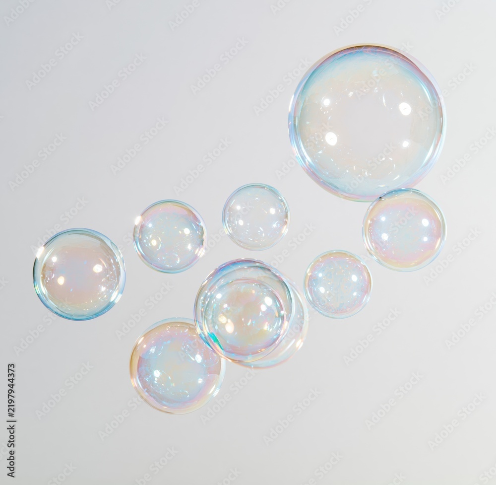 Fototapeta premium Colorful iridescent soap bubbles floating on white background