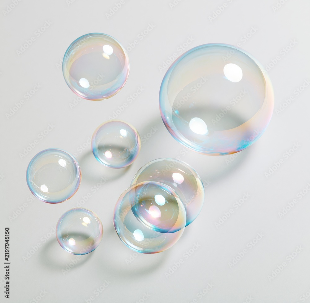 Fototapeta premium Colorful soap bubbles floating on white background