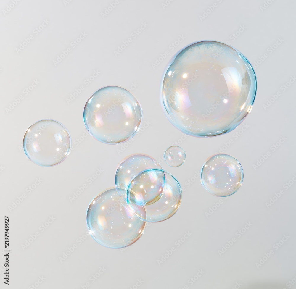 Fototapeta premium Colorful floating soap bubbles against a plain background