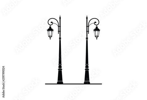 Two ornate street lamps depicted as a black silhouette on a white background