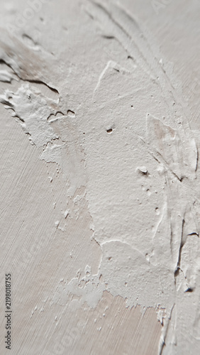 A bright minimal composition focusing on fine white plaster relief and elegant palette marks. neutral base, architectural pattern, clean backdrop, home interior.