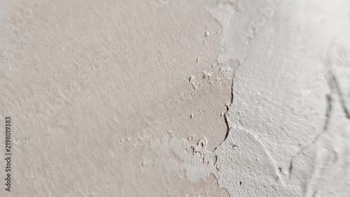 A soft light grey plaster finish showcasing subtle organic curves and smooth transitions. scandinavian design, delicate wall, minimal architecture, neutral backdrop.