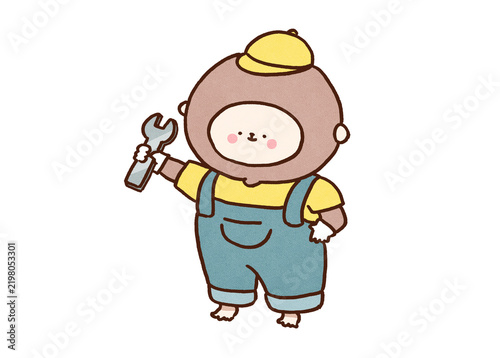 Fotografie Monkey in overalls holding a wrench in one hand, throw a monkey wrench into idio