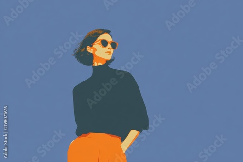 A woman wearing a black turtle neck sweater and orange pants with sunglasses on standing against a blue background.