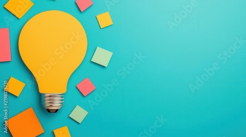 A yellow paper light bulb surrounded by colorful sticky notes on a blue background, symbolizing creativity and ideas.