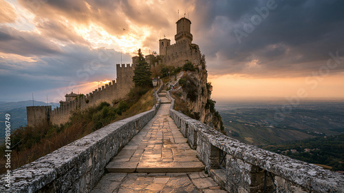 Ancient stone castle on a mountain ridge under dramatic sunset skies. Perfect for historical travel and fantasy landscape concepts.