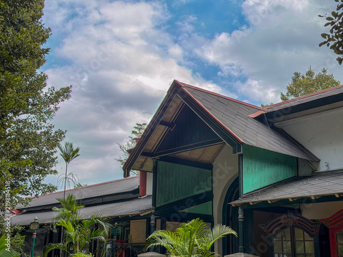 Bild auf Leinwand Javanese palace roof and pavilion architecture beneath blue cloudy sky