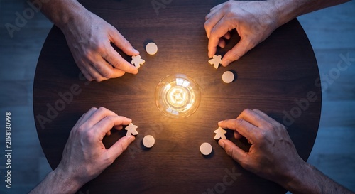 team hands gather tokens around illuminated bulb to contribute campaign ideas, coordinate creative input, and develop shared marketing direction
