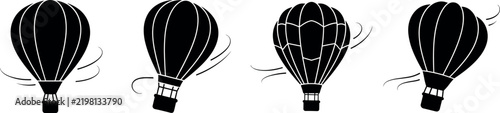 Four black silhouettes of hot air balloons floating in the sky with wind motion lines