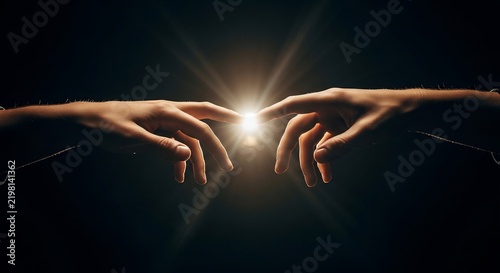 Fingers touching with radiant light, connection, unity, hope, creation, energy