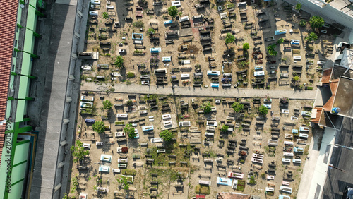 Obraz na plátně Aerial overhead view of traditional graveyard with rows of Javanese burial plots