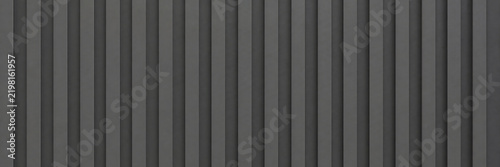 Industrial black corrugated metal texture, dark grey ribbed steel wall background, vertical grooved aluminum siding surface, minimalist architectural cladding for modern building design