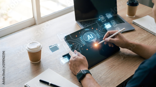 Person using a digital tablet with artificial intelligence interface overlay in a modern office