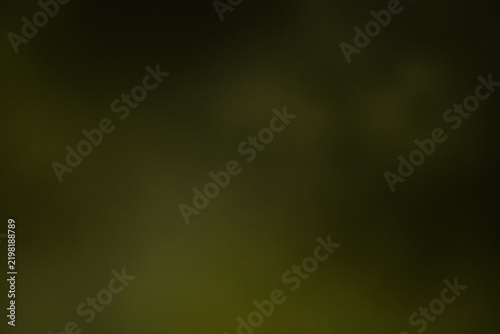 Dark grainy abstract background with amber glow, radial gradient, soft light, fine film grain, subtle noise texture, vignette, and generous copy space