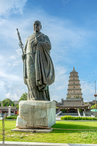 XI'AN, CHINA - JUNE 12, 2009: Bronze statue of the Buddhist monk Xuanzang in front of Da Ci'en Temple near the Giant Wild Goose Pagoda in Xi'an, Shaanxi, China. 