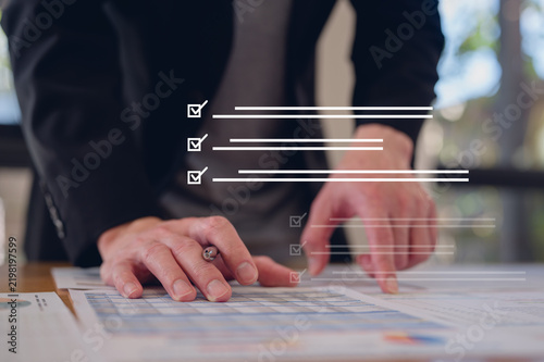Audit Document data system Report HR technology Concept, Businessman Manager checking white documents reports papers of files icon in modern office