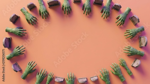 Green zombie hands and small tombstones arranged in a circle on orange background