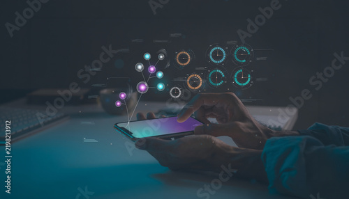 Person using smartphone with futuristic data analysis interface