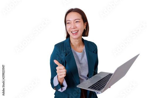 Asian businesswoman giving thumbs up gesture and smiling, holding laptop, expressing approval, success and happiness
