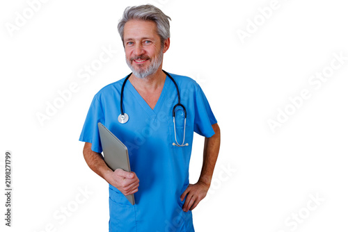 Male healthcare professional wearing blue scrubs and a stethoscope, holding a digital tablet, smiling confidently with a transparent background