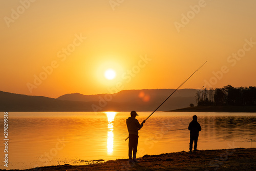 Father Son Fishing Silhouettes Lake Bank Sunrise Early Morning Golden Hour Sun Disk Family Relationship Bonding Leisure Activity Kids Together Beautiful Nature Landscape Stock Photo