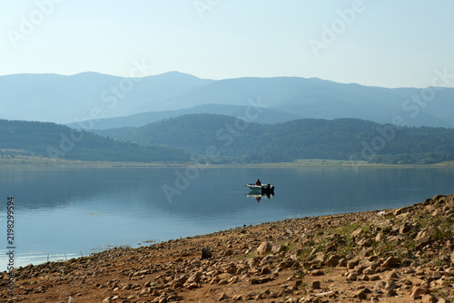 Fisherman Boat Silhouette Fishing Lake Middle Mountain Range Blue Sky Early Morning Hobby Freedom Calm Water Surface Batak Reservoir Bulgaria Nature Landscape Stock Photo