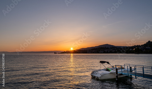 Sunset over Lake Geneva with pier in Montreux Switzerland
