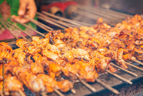 Freshly cooked chicken tikka pieces prepared for making butter chicken (murgh makhani), a popular North Indian curry, in a kitchen with spices and ingredients.