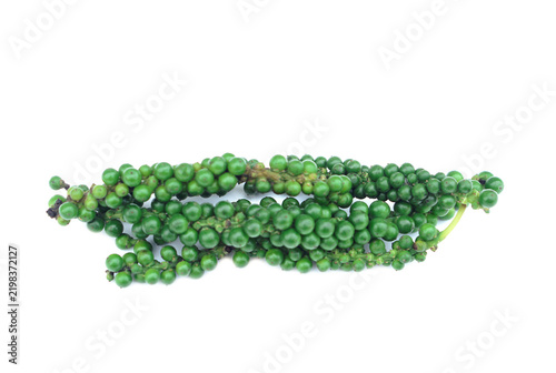 Fresh green peppercorns in clusters on a white background, isolated. Thai culinary spice for Asian cuisine, cooking, food packaging, recipes, and natural ingredient concepts.