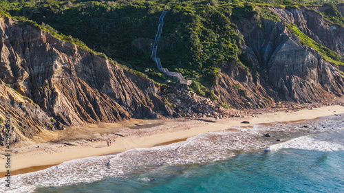 Couple walking the beach at Mohegan Bluffs on Block Island