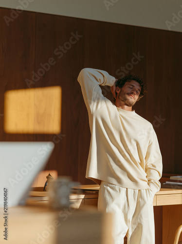 Man stretching with sunlight