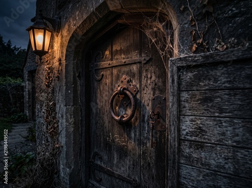Ancient Stone Doorway with Iron Ring Knocker, Key, and Lantern