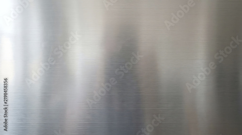 Brushed stainless steel metal sheet texture background for industrial design aesthetics.