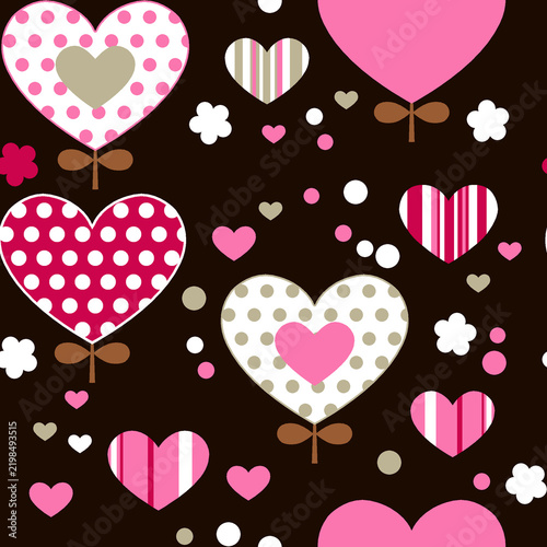 Colorful heart pattern with polka dots and stripes on brown background
