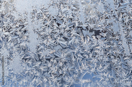 A beautiful natural background of frost patterns on glass.
