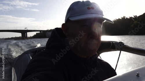 Stockholm, Sweden A man drives a motorboat on Lake Malaren in the early morning. 