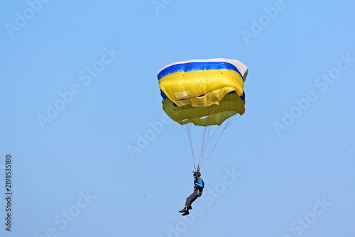 Skydiver in a blue sky	