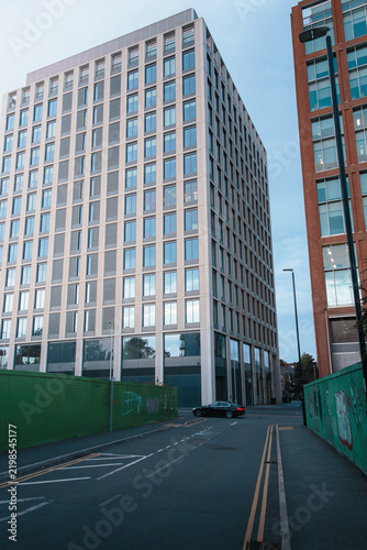 Coventry City skyline glowing in soft early morning September 2026 light across modern and historic architecture