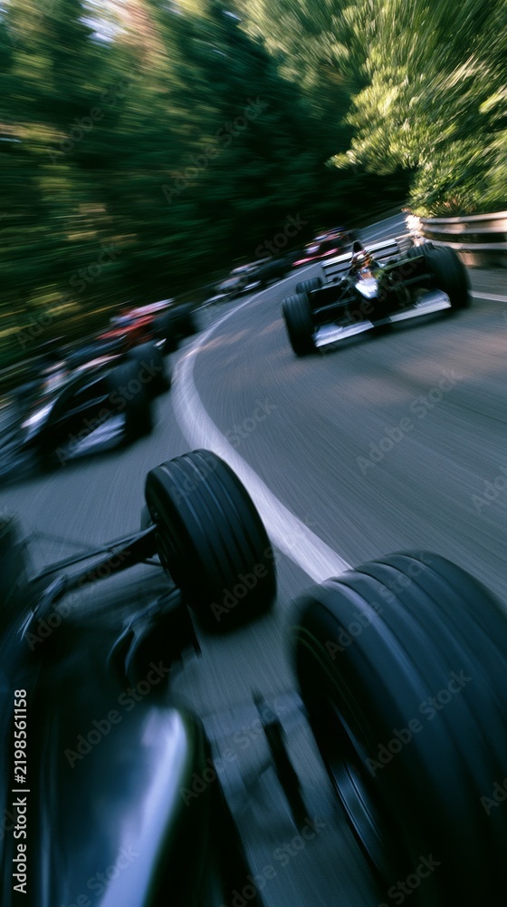 Obraz premium Formula One Race Cars Speeding Through a Track Turn
