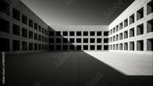 Black and white photo of an empty, angular concrete courtyard
