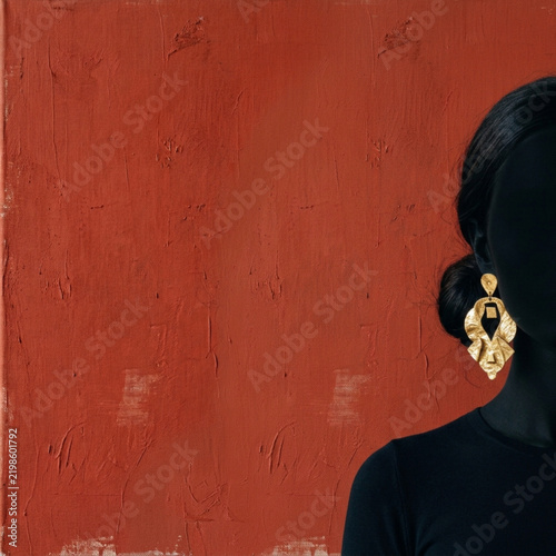 Professional woman with gold hoop earrings presenting a document in a modern office meeting room with clean copy space
