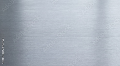 Brushed metal texture with horizontal lines and soft reflections, giving a sleek and modern feel
