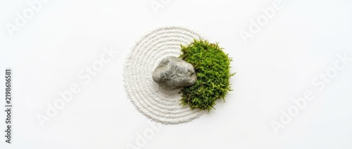 Zen Garden Concept With Stone And Moss On White Sand
