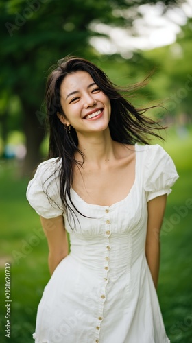 Happy East Asian Woman Enjoying Summer Day in Park