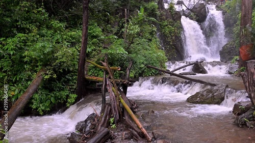 Huai Nam Yen Waterfall cascading through lush tropical rainforest in the rainy season in Omkoi District Chiang Mai, Thailand