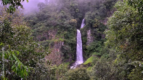 Huai Nam Yen Waterfall cascading through lush tropical rainforest in the rainy season in Omkoi District Chiang Mai, Thailand