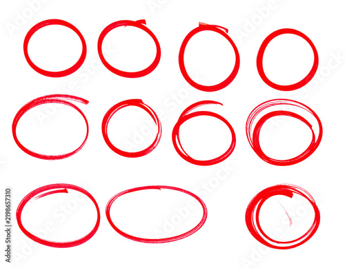 Red circles drawn with felt tip marker pen showing hand drawn highlight shapes for graphic design projects  